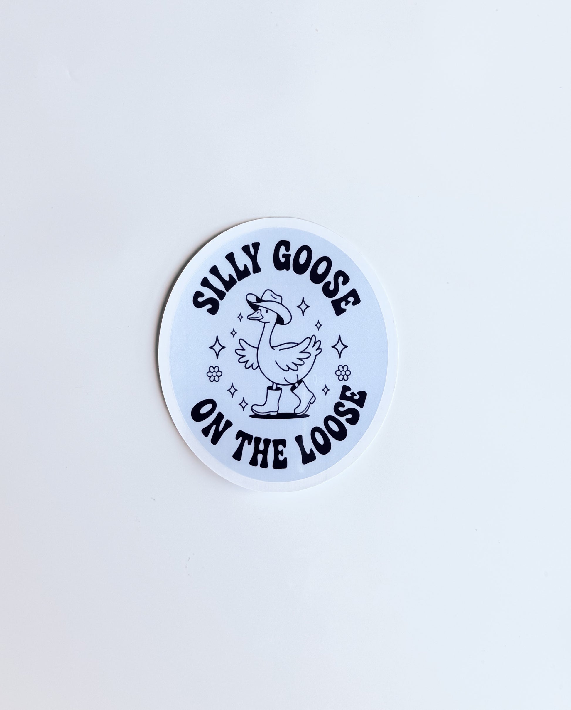 Circular sticker with 'Silly Goose on the Loose' text and graphic on a light blue background
