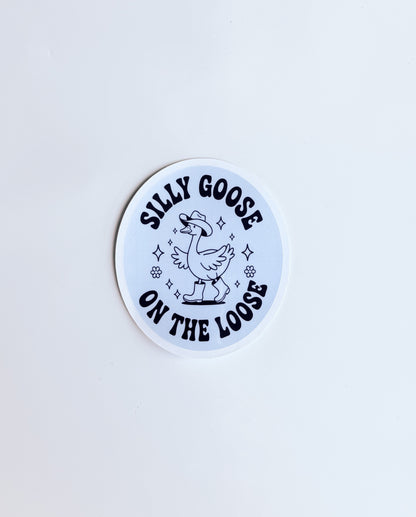 Circular sticker with 'Silly Goose on the Loose' text and graphic on a light blue background