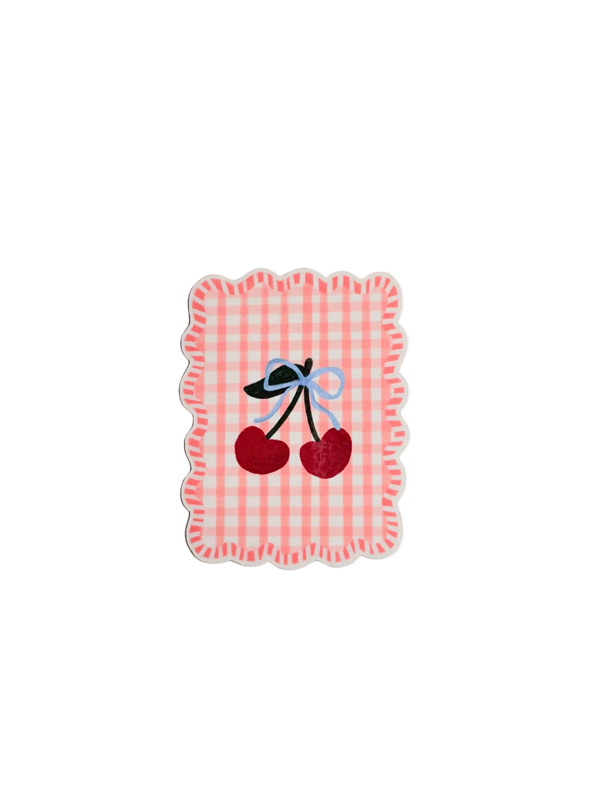 Decorative coaster with cherry design on a light gray background
